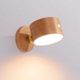 Beech wall sconce shown from the side on its round magnetic wall plate