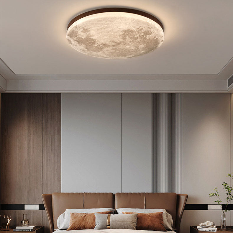 Moon flush mount ceiling light lit to show its even internal glow