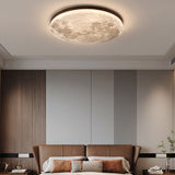 Moon flush mount ceiling light lit to show its even internal glow