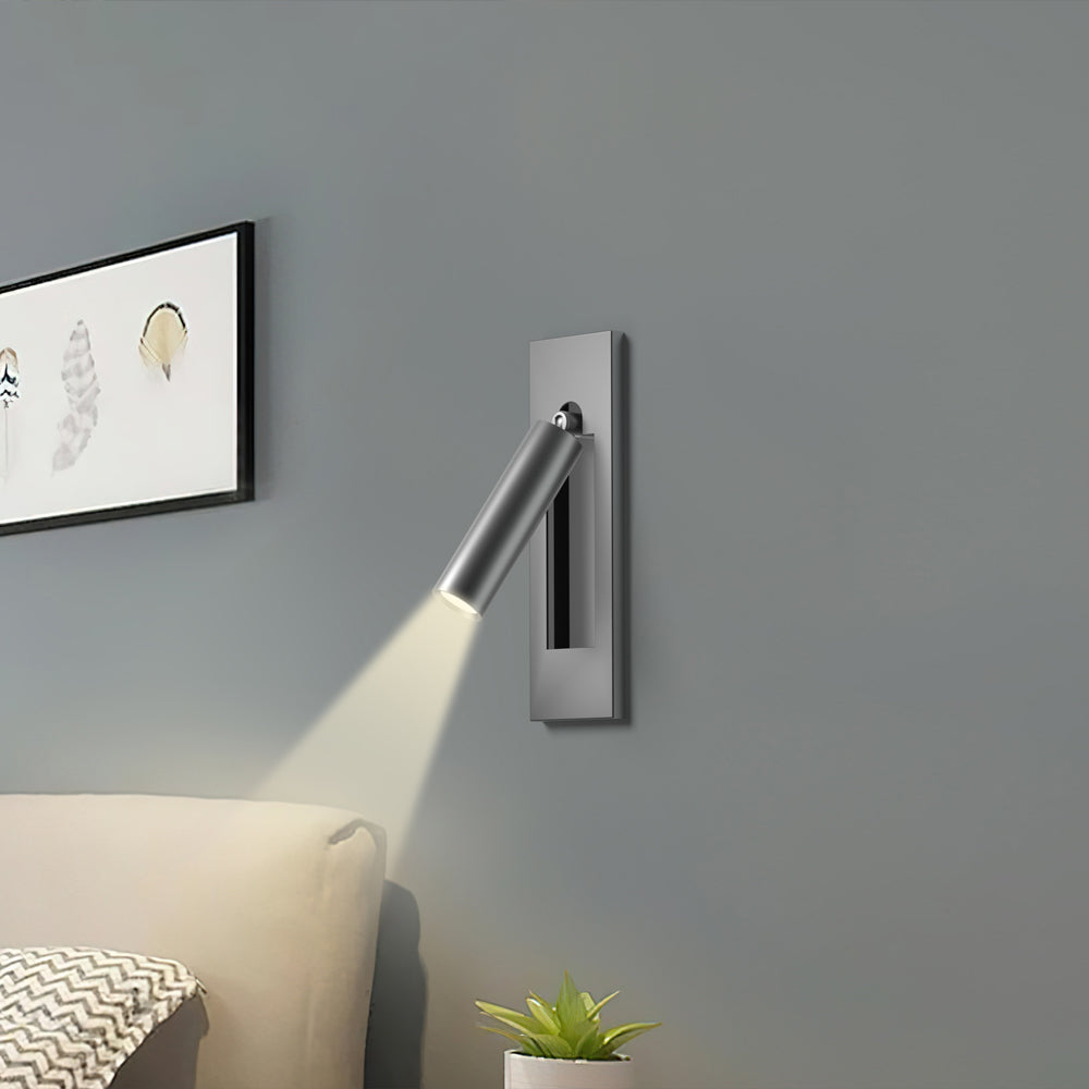 Reading sconce spotlight tilted for over-shoulder reading in bed