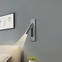 Reading sconce spotlight tilted for over-shoulder reading in bed