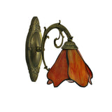 Wall sconce shown mounted with the petal shade facing downward