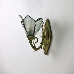 Petal glass wall sconce measured to show its height and width