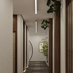 Wood grain LED linear light seen against a soft grey ceiling