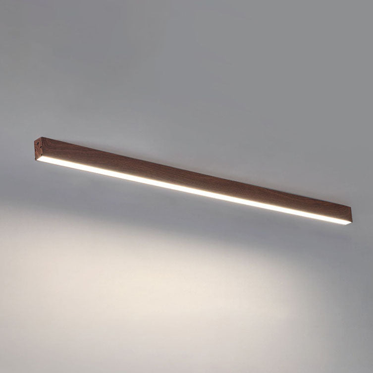 Low profile linear bar light hugging a white plaster ceiling