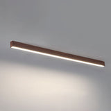 Low profile linear bar light hugging a white plaster ceiling