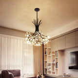 Black glass chandelier in a living room above shelving and a television