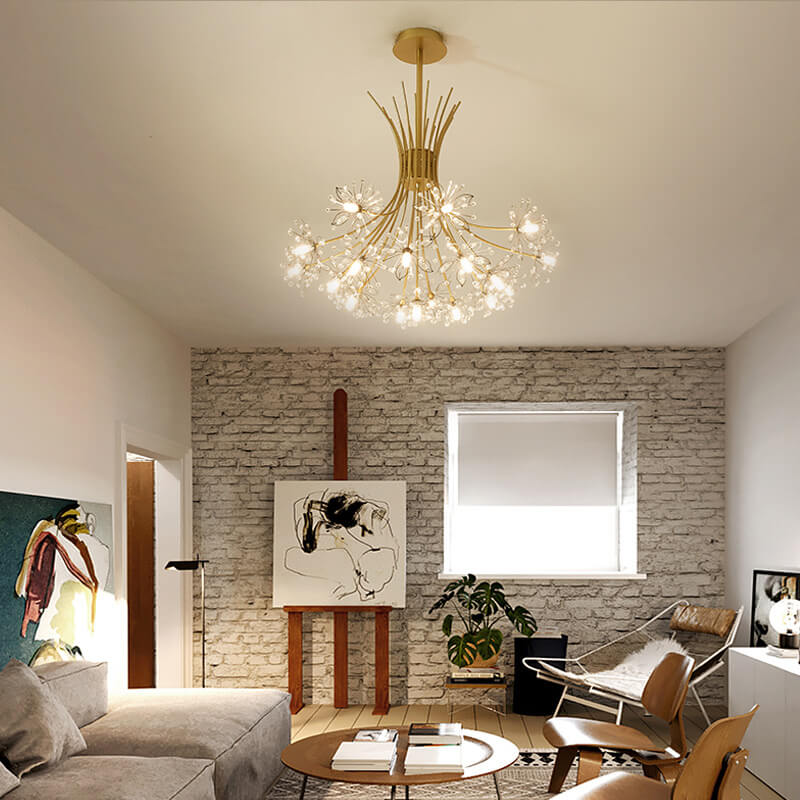 Gold glass chandelier in a living room with a brick wall and easel