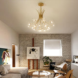 Gold glass chandelier in a living room with a brick wall and easel