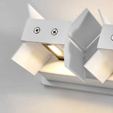 Close view of a white sconce showing its slim rectangular aluminum body