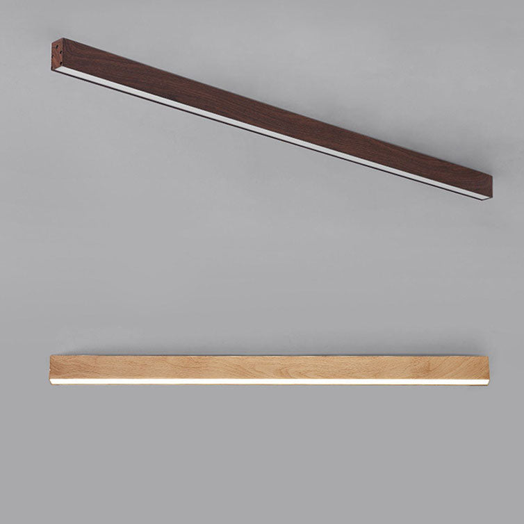 Wood grain LED flush mount light lighting a modern entryway