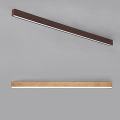 Wood grain LED flush mount light lighting a modern entryway