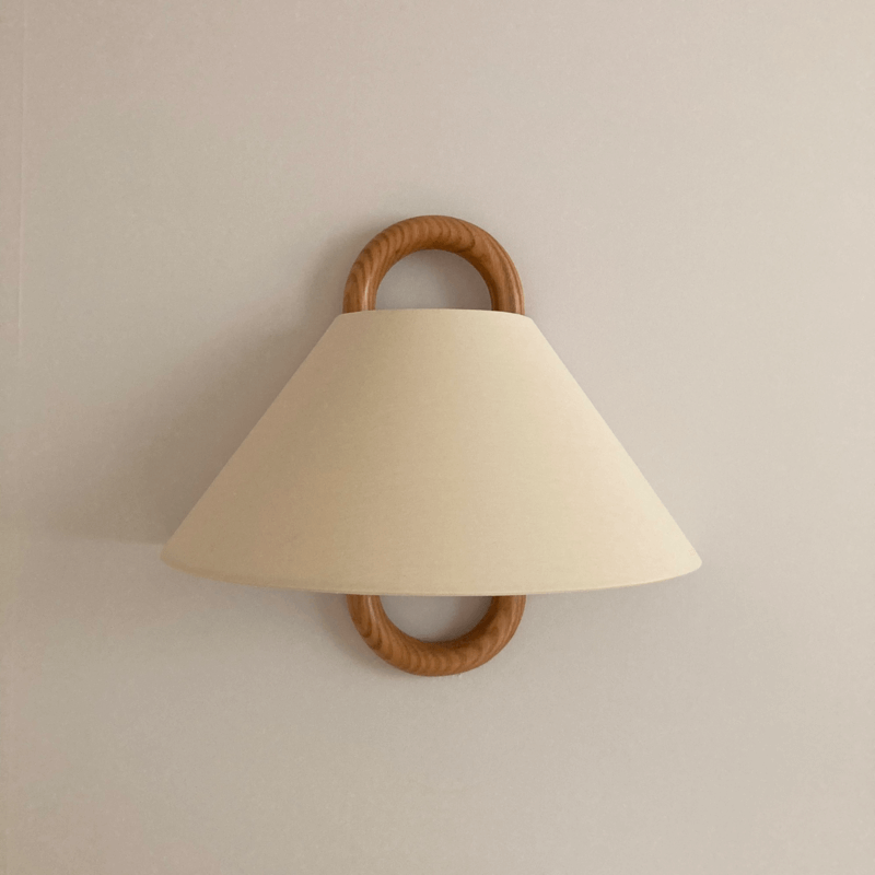 Flat fabric shade version of the wall sconce