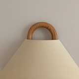 Close view of the pleated fabric shade on the wall sconce