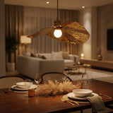 Close view of a hammered gold lotus leaf shade and brass socket
