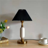 Side profile of the table lamp showing pleated shade and column base