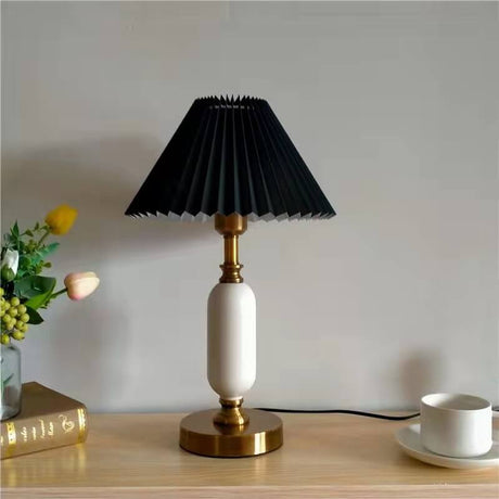 Side profile of the table lamp showing pleated shade and column base