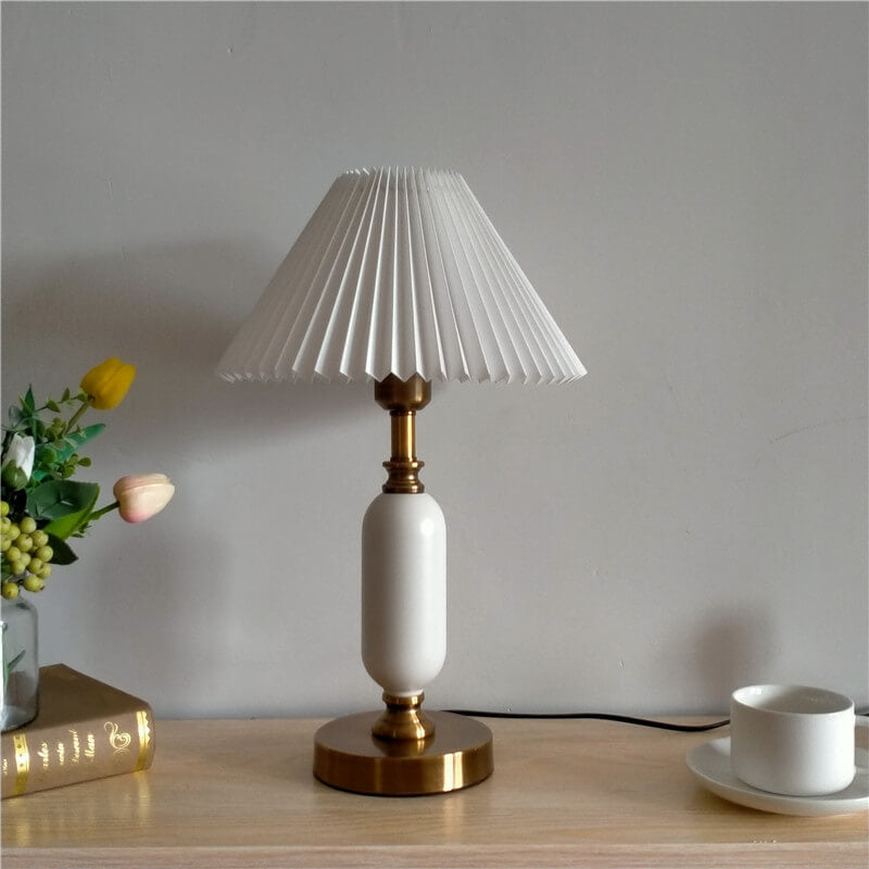 Angled view of the pleated shade lamp and brass hardware fittings