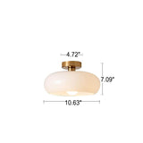 Amber glass ceiling light detail showing the glossy curved glass