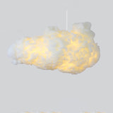 Textured fluffy cloud pendant light glowing softly on a grey background