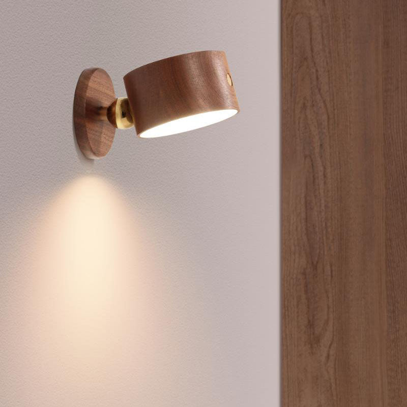 Wooden wall sconce head detached from the magnetic base in hand