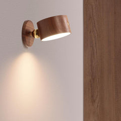 Wooden wall sconce head detached from the magnetic base in hand