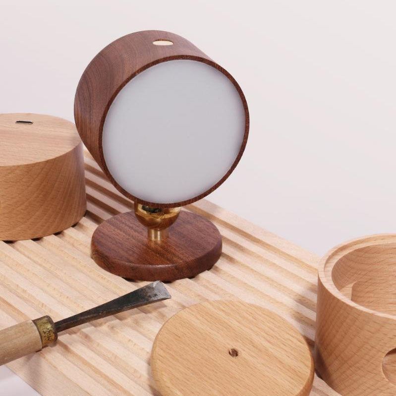 Wall sconce head rotating on its brass ball joint to angle the light