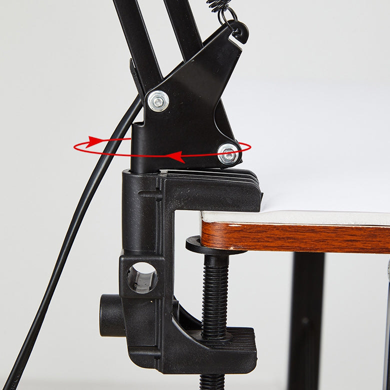 Close view of the clamp base gripping a desk edge
