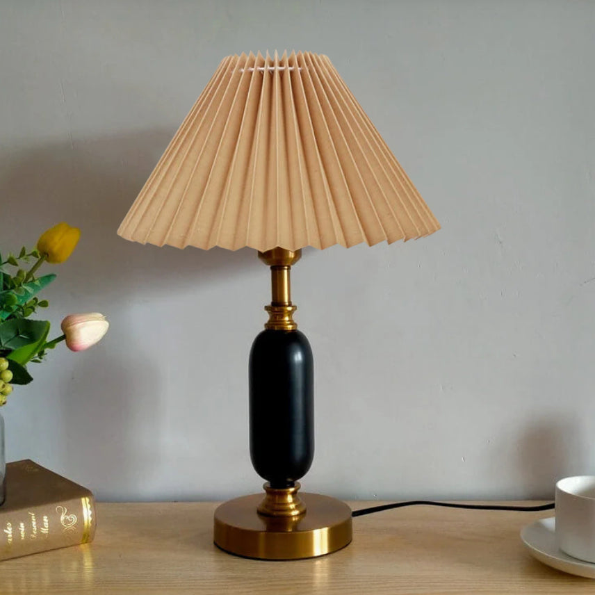 Close view of pleated fabric shade and brass socket cup detail