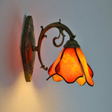 Petal stained glass sconce photographed against a plain background