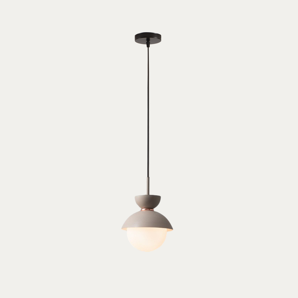 Macaron pendant light detail showing the frosted glass globe and dome edge