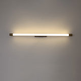Modern LED wall sconce shown at an angle with brass caps and black backplate