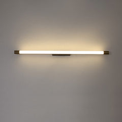 Modern LED wall sconce shown at an angle with brass caps and black backplate