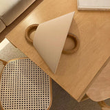 Fabric wall sconce with the bulb glowing through the shade