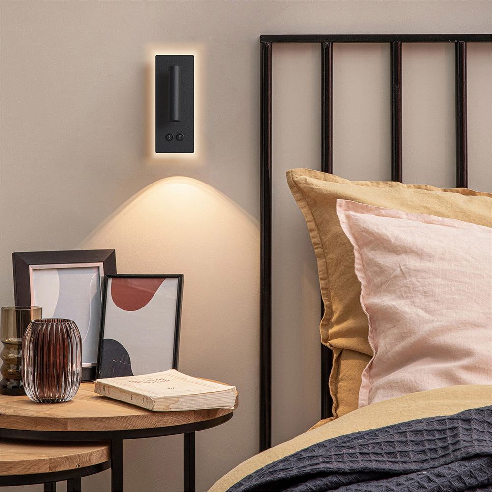 Compact wall mounted reading lamp for a bedside setting