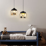 Two black-capped animal pendant lights above a blue kids bed with plush toys