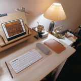 Upper pleated shade and slim brass neck of the table lamp