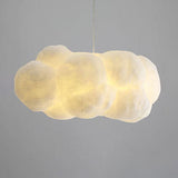 Warm-lit cloud pendant light with a soft handcrafted fabric shade