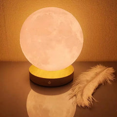 3D moon lamp styled on a nursery shelf