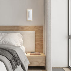Modern bedside wall sconce mounted at shoulder height