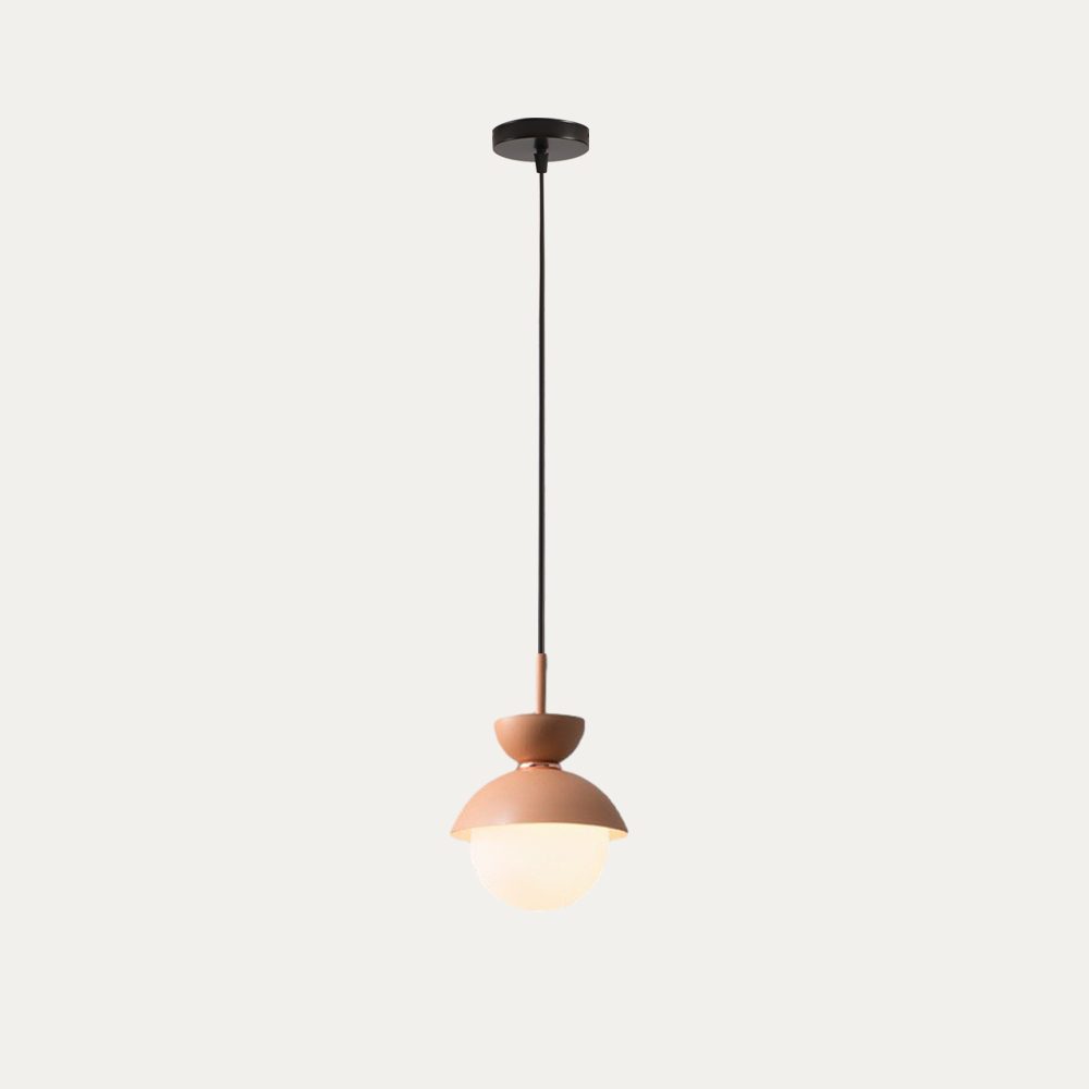 Macaron pendant light hanging low over a small round side table