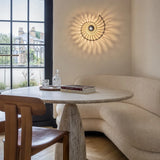 Black shell wall light viewed from an angle