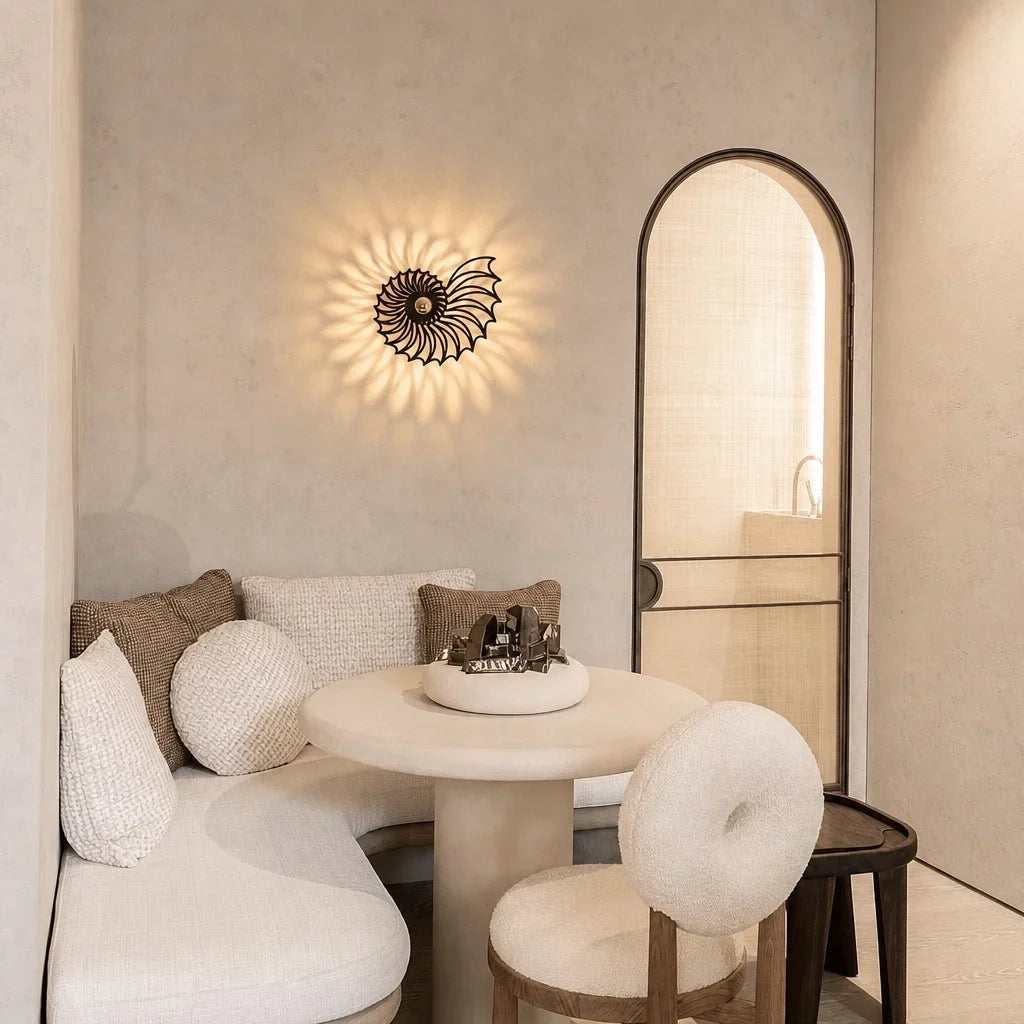Shell wall light glowing with warm integrated LED