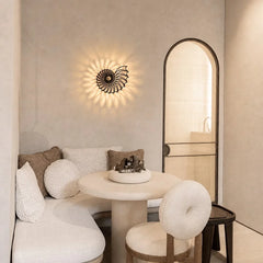 Shell wall light glowing with warm integrated LED