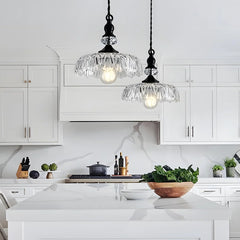 Detailed look at the floral cut pattern of the glass pendant shade