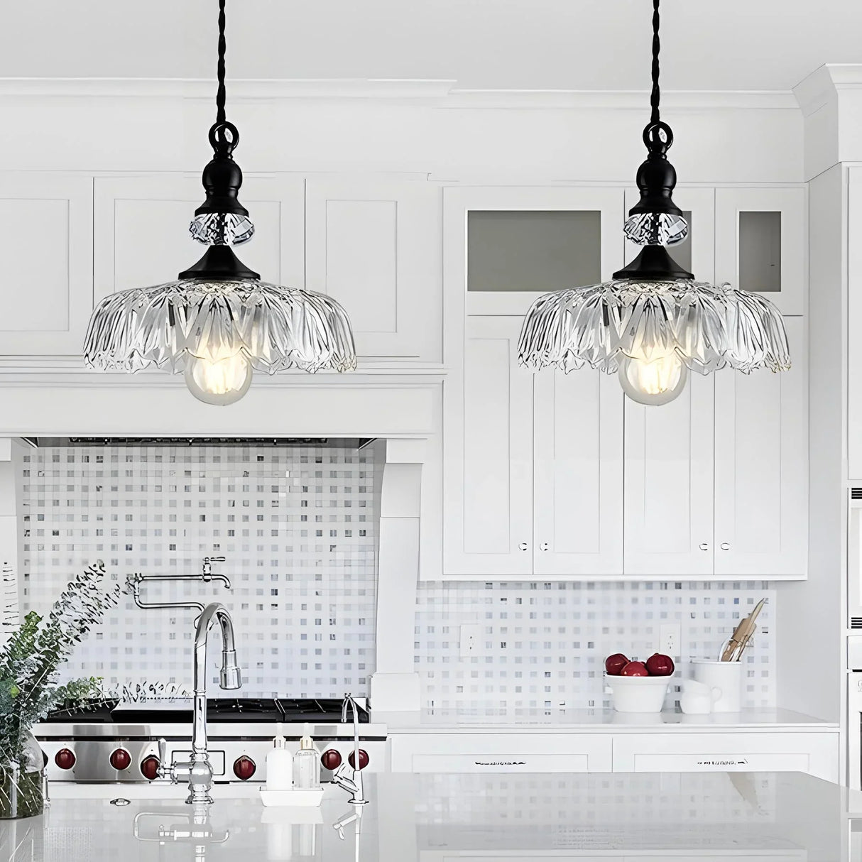 Clear glass flower pendant shade catching light along its ribbed edges