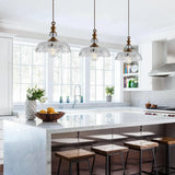 Brass pendant fitting and crystal knob above the cut-glass flower shade