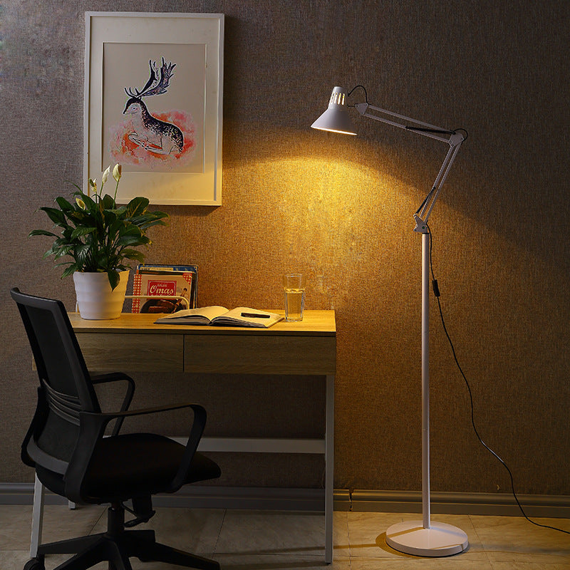 Adjustable floor lamp with folded spring-balanced arm and round weighted base