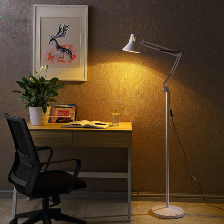 Adjustable floor lamp with folded spring-balanced arm and round weighted base