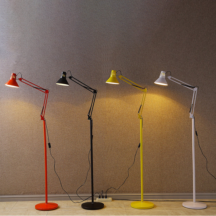 Cone shade tilted down to aim task light onto a reading surface